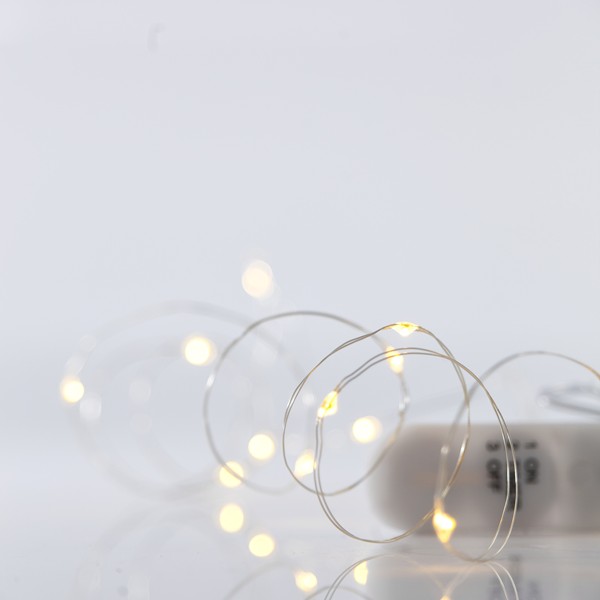LÍNEA, 12 MINI LED, CAJA DE PILAS 2xCR2032, CABLE DE COBRE PLATEADO, BLANCO CÁLIDO, POR 10 cm, CABLE DE CONDUCCIÓN 10 cm, IP20